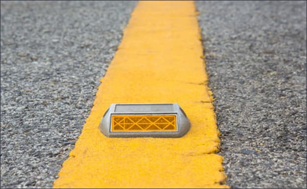 road stud with yellow reflector