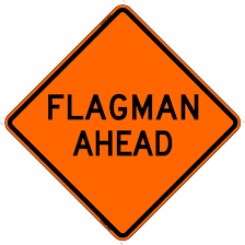 Flagman Ahead Sign