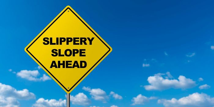 Slippery Road Ahead Sign