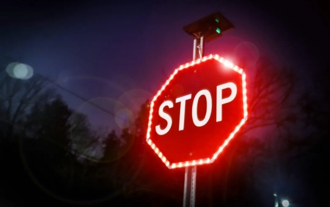 Solar LED Flashing Sign at Night