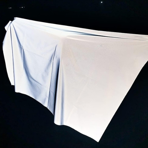 Material reflectante de luz para ropa